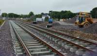 The new station site is progressing well, platforms are nearly complete, the footbridge is being erected and track laid. This view looks east, with the signal box in the distance.<br><br>[Alan Cormack 07/07/2017]