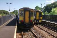 An Edinburgh-bound 156 and a 158 for Glasgow pass at Livi South on a fine 24 July.<br><br>[David Panton 24/07/2017]