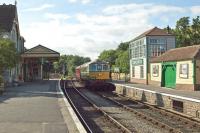 On 4th July 2017, the last train of the day (the 17.38 service from Wareham to Swanage) enters Corfe Castle station. The token exchange is taking place and the locomotive is Class 33 D6515. Once a ruin like the adjacent castle, this restored station is a glowing testament to enthusiasts who are determined not to sit back and let “history take its course”.   <br><br>[Mark Dufton 04/07/2017]