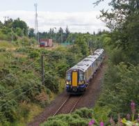 380 105 passes the sidings at Hunterston High Level with a train for Largs.<br><br>[Ewan Crawford 03/08/2017]