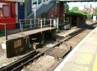 The arrangement at the double-island platform station at Brockenhurst, Hampshire, in 2002, where a rotating turntable bridge was employed to provide step free access (on request) between the station entrance and platforms 1 & 2. (Step free access to platforms 3 & 4 was across the trackbed.) The arrangement came to an end in 2014 when the station received a new footbridge with integral lifts. [See image 47749]<br><br>[Ian Dinmore 26/07/2002]
