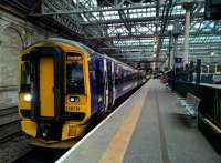 The 19.55 to Tweedbank stands at Waverley - with unofficial carry-on dining from various station food outlets.<br><br>[Ken Strachan 04/08/2017]