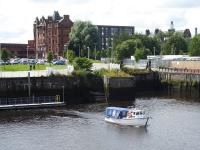 The modern day Govan Ferry, as seen from the <I>Glenlee</I> tall ship at the Riverside Museum of Transport in July 2017. The little boat provides a handy free link to the museum from Govan Subway station using the pontoon seen here.  [See image 54433] showing the slipway that used to be used for its larger predecessor. <br><br>[Mark Bartlett 31/07/2017]