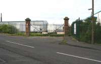 The surviving rail entrance gates of the T Y Paterson brewery on Duddingston Road West, one of the seven breweries operating in the area in the 1930s. Photographed looking west across the site of the level crossing on a Sunday morning in August 2017. Last photographed in March 2007 <I>'just prior to demolition!'</I> [See image 14240]<br><br>[John Furnevel 06/08/2017]