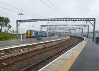 Platform 1 at Gourock is very convenient for ferry passengers but if Platform 3 is in use it is a bit of a trudge. 380108 waits in Platform 3 to form a fast service to Glasgow Central on 31st July 2017. <br><br>[Mark Bartlett 31/07/2017]