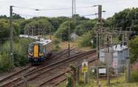 380108 takes the Ardrossan Harbour line at Holm Junction. Ahead is the turnback siding and to the right the Largs branch.<br><br>[Ewan Crawford 10/08/2017]