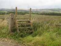 A well preserved set of up and over concrete steps, with hand grab posts intact, still sits astride a fence alongside one gate post from a farm crossing between Staithes and Hinderwell, on the former Saltburn to Whitby West Cliff line. Considering the line closed in May 1958, these have survived remarkably untouched in the intervening 59 years. It only needs a replica wooden gate to complete the scene. <br><br>[David Pesterfield 06/08/2017]