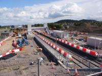 A view of the re-sited Forres station nearing completion taken from the new overbridge built to replace the Waterford Road level crossing on the east side of the station. View taken during an organised visit to the site.<br><br>[Douglas Blades 29/08/2017]