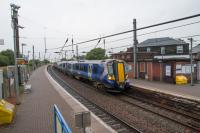 Southbound train pausing at Newton-on-Ayr. The almost entirely bricked up building on up platform continues to stand.<br><br>[Ewan Crawford 07/09/2017]