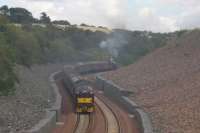Author Sandy Mullay's description of a 'sinuous succession of curves'<br>
comes to mind in this long shot of the SRPS Railtour passing through the<br>
distinctive deep stone cutting at the south end of Borthwick Bank.<br><br>[David Spaven 20/08/2017]