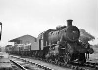Ivatt 2MT 2-6-0 46430 shunting mixed goods wagons alongside the small goods shed at Garstang Town station. This loco was new to Preston shed in December 1948 but later went to Stoke-on-Trent so this image will probably be from the early 1950s. <br><br>[Knott End Collection //]