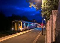 The 22.00 to Newcastle-upon-Tyne pauses at Haltwhistle on 2nd August. The light in the signal box is deceptive - it is no longer in use. <br><br>[Ken Strachan 02/08/2017]