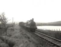 Ex-Caledonian 'Jumbo' 0-6-0 57362 approaching Loch Skerrow on 14 July 1956 with a Newton Stewart - Castle Douglas goods. <br><br>[G H Robin collection by courtesy of the Mitchell Library, Glasgow 14/07/1956]