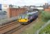 142018 squeals on the sharp curve as it leaves Hartlepool with a Nunthorpe to Newcastle service on 24th June 2017. On the left is the freight only Up Line and disused platform.  <br><br>[Mark Bartlett 24/06/2017]