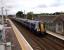 A North Berwick service calls at Prestonpans with a North Berwick service on 31 July. Prestonpans styles itself 'Scotland's Mural Town' and indeed murals bedeck the typical North British station building.<br><br>[David Panton 31/07/2017]