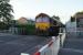 DBC 66167 sets off from a signal check on 15 August 2017 and crosses Low Moor LC in Clitheroe whilst working the Clitheroe Castle Cement to Bescot loaded cement tanks. The ultimate destination of the train is Avonmouth.<br><br>[John McIntyre 15/08/2017]