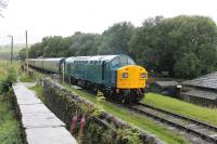 EE Type 4 40135 has been based on the East Lancashir Railway since 1988. It went to Barrow Hill in late 2016 for bodywork repairs, followed by a full repaint at Derby. Looking resplendent in its new coat of BR Blue it whistles away from the Irwell Vale halt heading for Rawtenstall on 19th August 2017.  <br><br>[Mark Bartlett 19/08/2017]