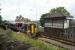 A York to Blackpool service crosses the level crossing at Towneley on the south side of Burnley. The signalbox now only looks after the level crossing, the signalling being controlled from Preston PSB since October 1973.<br><br>[John McIntyre 17/08/2017]