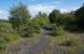 The site of Bartonholm Colliery Pit No 1 which later became a depot within the ICI Bogside (Snodgrass) Works of Nobel Explosives, the east part of the Ardeer works. This view looks to Bogside Junction. Snodgrass workers platform was somewhere in this vicinity.<br><br>[Ewan Crawford 17/08/2017]