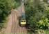 Train 662A, the Sunday 0800 Mossend - Millerhill, runs through Craiglockhart Junction on 27 August 2017 behind Freightliner 66528. Photographed looking north from the towpath of the Union Canal.<br><br>[John Furnevel 27/08/2017]