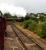 The K1 passes its support coach as it accelerates past Tom Na Faire depot with the morning Jacobite on 14/08/17.<br><br>[Alan Hardie 14/08/2017]