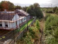 I last visited this location in 1985, when I took a photo [see image 18724]. Looking at other RailScot images it has all been downhill since then! The old station buiding is having some work done. This was once on the Waverley Route, but the Borders Railway made a deviation to the west in the section containing Shawfair station. The new line and the course of the old one converge, coincidentally, where King's Gate Junction now is.<br>
<br>
<br><br>[David Panton 15/09/2017]