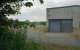 After closure of the Caledonian Railway's Irvine Bank Street terminus the site became a light industrial estate. This shed occupied the station area. The single platform was on the right, there was a loco release line and the goods yard on the left. The brick feature on the left is probably not the platform, but at a similar site. The shed has since been demolished and this is now the Caledonian Car Park - nice touch.<br><br>[Ewan Crawford //1998]