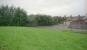 Unfortunately by 1996 this is what remained of the Caledonian station in Kilwinning. The station platforms ran from the trees to the left, into the foreground alongside the wall. After much landscaping whatever was left was in those trees. Further redevelopment has seen the grassy area become a car park.<br><br>[Ewan Crawford //1996]