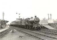 A Saturday St Enoch - Darvel train restarts from the Irvine stop on 4 July 1959. In charge is one of Hurlford shed's 2P 4-4-0s no 40645.<br><br>[G H Robin collection by courtesy of the Mitchell Library, Glasgow 04/07/1959]