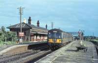 A Cravens DMU pulls away from Garstang and Catterall heading for Lancaster as alighting passengers head for the footbridge. Prior to 1930 there would have been a connection to the Knott End branch railmotor on the other side of the island platform. The main station building can be seen on the Up line. This splendid colour photo was probably taken in the late 1960s. The 1964 timetable shows four Up and five Down departures on weekdays with an extra mid-day service each way on Saturdays. The station closed in 1969, following which the site was cleared for the 1972 WCML electrification. <br><br>[Knott End Collection //]