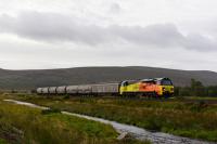 70811 makes history as the first Class 70 to operate on the Highland Main Line.Pictured at Moy with a cement train for Inverness.<br><br>[John Gray 04/10/2017]