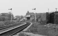 Looking west from the station platforms to Elgin West signalbox in 1991. These semaphores and the other mechanical signalling apparatus at Elgin are scheduled to be abolished in October 2017.<br>
<br>
<br><br>[Bill Roberton //1991]
