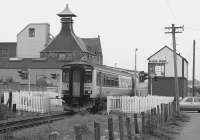 156494 passes Elgin West signalbox with an Inverness service in 1991. The signalbox will be abolished and associated signalling replaced in October 2017 but the Sprinter remains in Scotrail service working out of Corkerhill.<br>
<br>
<br><br>[Bill Roberton //1991]