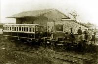 An old grainy photo showing the first locomotive of the Garstang & Knot End Railway at Garstang Town around 1871. This was <I>Hebe</I>, a Manning Wardle 0-4-2ST and when the line opened in December 1870 it was their only locomotive. After more than a year of continuous use it broke down, leading to financial problems for the G&KER and <I>Hebe</I> being repossessed. The line closed in 1872 but reopened in 1875 with two new locomotives, Manning Wardle 0-4-0ST <I>Union</I> and Hudswell Clarke 0-6-0ST <I>Farmers Friend</I>, which had a piercing whistle and became unofficially known as <I>The Pilling Pig</I>. Garstang station was later rebuilt as an island platform.<br><br>[Knott End Collection //1871]