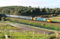 37403 <I>Isle of Mull</I> propelling 2C32 Carlisle to Preston at Morecambe South Junction on 28th September 2017. This new vantage point near the lay-by on the <I>Bay Gateway</I> link road looks likely to be short lived judging by the tree planting on the embankment. <br><br>[Mark Bartlett 28/09/2017]