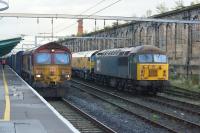 66111 pauses at Carlisle whilst working a Daventry to Grangemouth container train on 7th October 2017. In the sidings on the right 56303 is stabled with a rail grinder.<br><br>[John McIntyre 07/10/2017]