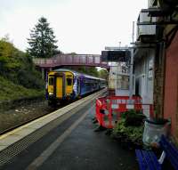 An Ayr to Girvan service calls at Maybole, the only intermediate station,<br>
on 10th October 2017. An information screen is at last being installed. Note the<br>
long-abandoned second platform.<br>
<br>
<br><br>[David Panton 10/10/2017]