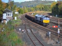 DRS 66303 passes Stirling North signal box with an empty ballast to Millerhill.  The main line was blocked at Cornton a little to the north for EGIP work, with Alloa branch (on the right) services unaffected.<br><br>[Bill Roberton 22/10/2017]