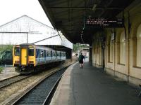 Looking north along platform 6 on the west side of Exeter St Davids station on on the morning of 30 June 2002. DMU 150267 is stabled alongside awaiting its next duty. <br><br>[Ian Dinmore 30/06/2002]
