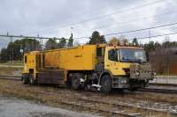 L&S (Luddenheit und Scherf GmbH) Rail grinder RRGM 1-20 waits in one of the sidings at Järpen Station. This machine has been undertaking overnight maintenance on the line west of this town. These sidings originally for freight now see some use by engineering trains including ballast loading operations. Postboat <I>Lisa</I> was probably unloaded here nearly 100 years ago [see image 61247]<br><br>[Charlie Niven 30/10/2017]