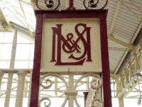 Here's a cartouche on Llandudno Station. Initially I thought it had to be the old LNWR, then a rethink was it the Manchester, Sheffield and Lincolnshire Rly? However second thoughts and a with deeper look I saw LM&S.<br><br>[Peter Todd 27/10/2017]