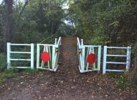 As Douglas Adams might have said: almost exactly, but not quite, level crossing gates. Ornamental entrance to the Weddington Railway Walk from Weddington Road.[see image 26581] for a winter view nearer to the Trent Vally main line.<br><br>[Ken Strachan 28/10/2017]