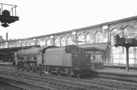 Royal Scot 46114 <I>Coldstream Guardsman</I> waits at signals alongside Carlisle platform 4 on 27 July 1963. The locomotive had recently arrived with a train from the south and was awaiting the clear to run back to Upperby shed.<br><br>[K A Gray 27/07/1963]