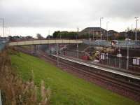 Merryton Station in Larkhall with piper at the official reopening of the Hamilton to Larkhall line - 9th December 2005.<br><br>[Gordon Steel 09/12/2005]