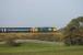 37403 <I>Isle of Mull</I> is in the autumn sunshine as it propels 2C32 Carlisle to Preston over the embankment at Bay Horse on 26th September 2017.  <br><br>[Mark Bartlett 26/09/2017]