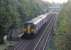 Sprinter 150201, working from Kirkby to Blackburn via Manchester and Todmorden, almost made an unscheduled stop at Huncoat station on 16th October 2017 but the colour light protecting the crossing cleared just in time. This view looks south from the bridge that used to be the access point for Huncoat Colliery, which closed in 1968. <br><br>[Mark Bartlett 16/10/2017]