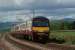 A pair of Class 320 units with 320307 leading, skirt the River Clyde approaching Brooks Road user worked LC between Ardmore East and Cardross on 28 May 2010. <br><br>[John McIntyre 28/05/2010]