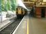 A sunny sfternoon at Brockenhurst on 26 July 2002, with a service to Lymington Pier boarding at platform 4.<br><br>[Ian Dinmore //]