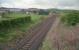 View north at Grangeston Halt. This was a two platform halt just north of Girvan Junctions which served the large ICI Grangeston munitions factory from 1941 to 1965. Two brick built platforms remain intact but the line has been slewed to the centre following reduction to a single track.<br><br>[Ewan Crawford //2002]