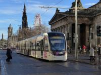 Tram 277, carrying 'Free trams on Hogmanay night' branding, heads east past the Royal Scottish Academy on 4th December 2017.<br>
<br><br>[Bill Roberton 04/12/2017]